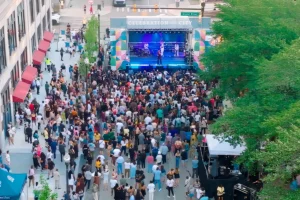 Aerial view of outdoor concert crowd at Book Tower grand opening